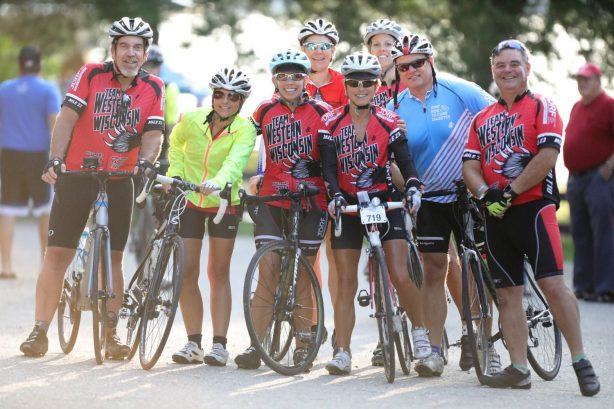 Bikers lined up and smiling at the Lake Ripley Ride Cambridge