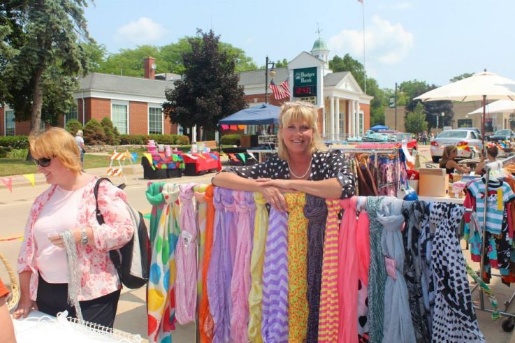 Lady by colorful scarves at Maxwell Street Days Cambridge
