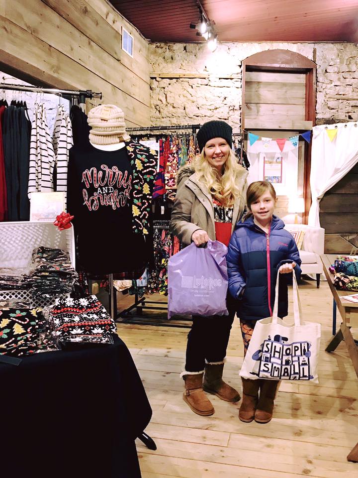 A girl and her mom are shopping at Small Business Saturday