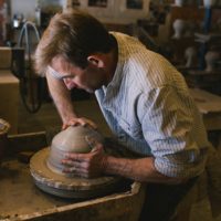 Mark Skudlarek from Cambridge Woodfired Pottery, working the potter's wheel